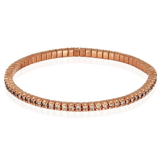 Elastična zlatna tenis narukvica od 9 kt roze zlata (12,80 gr) ukrašena Braon Dijamanata (oko 2.30 ct), u dve veličine, manja ženska narukvica i veća muška narukvica. Narukvica se sastoji od neprekidnog niza dijamanata iste veličine postavljenih na segmentima od zlata, koji kombinuju klasični dizajn tenis nakita sa inovacijom koja je čini elastičnom, sigurnom i lakom za nošenje. Svaki Braon Dijamant drže po četiri krapne.